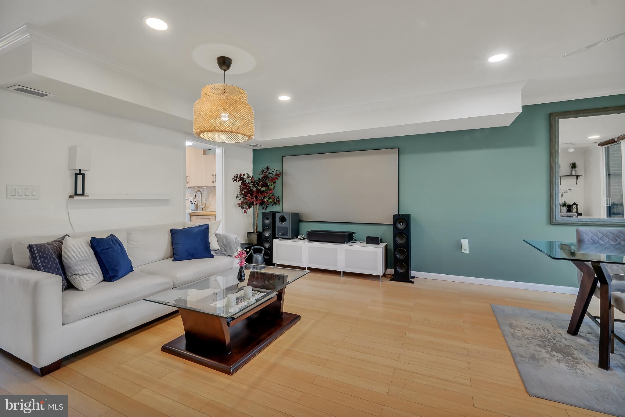 11604 Ivystone Court, Unit 6 Reston, VA 20191 - Photo 29 of 36 a living room with furniture and a chandelier