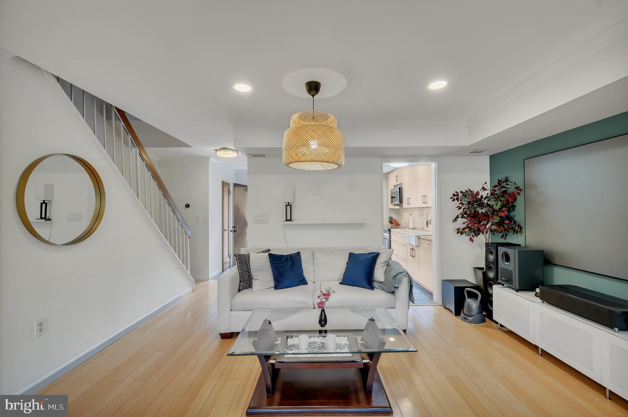 11604 Ivystone Court, Unit 6 Reston, VA 20191 - Photo 30 of 36 a living room with furniture and a chandelier
