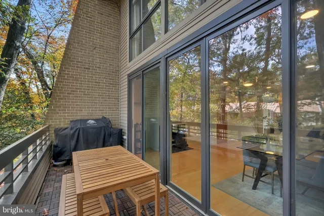 a balcony view with a outdoor seating