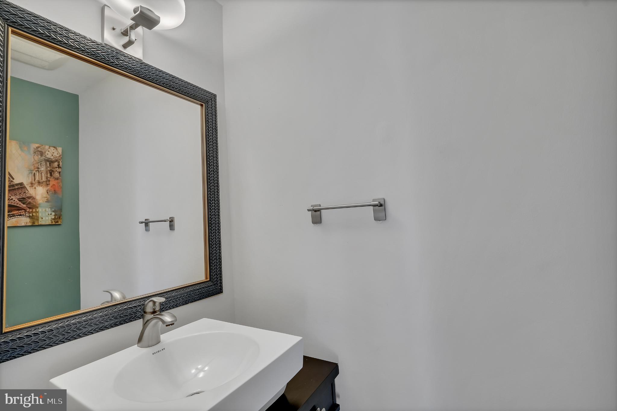 11604 Ivystone Court, Unit 6 Reston, VA 20191 - Photo 7 of 36 a bathroom with a sink and a mirror