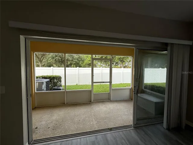 a view of an empty room with a large window