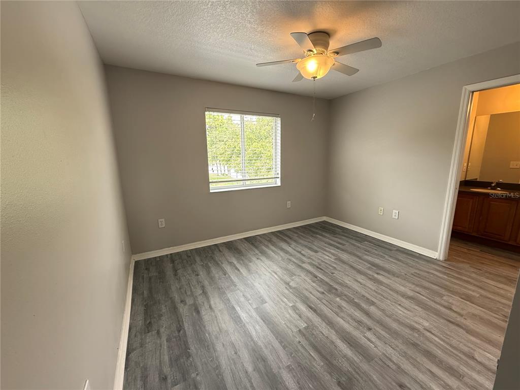 20460 Needletree Drive Tampa, FL 33647 - Photo 15 of 28 wooden floor in an empty room with a window