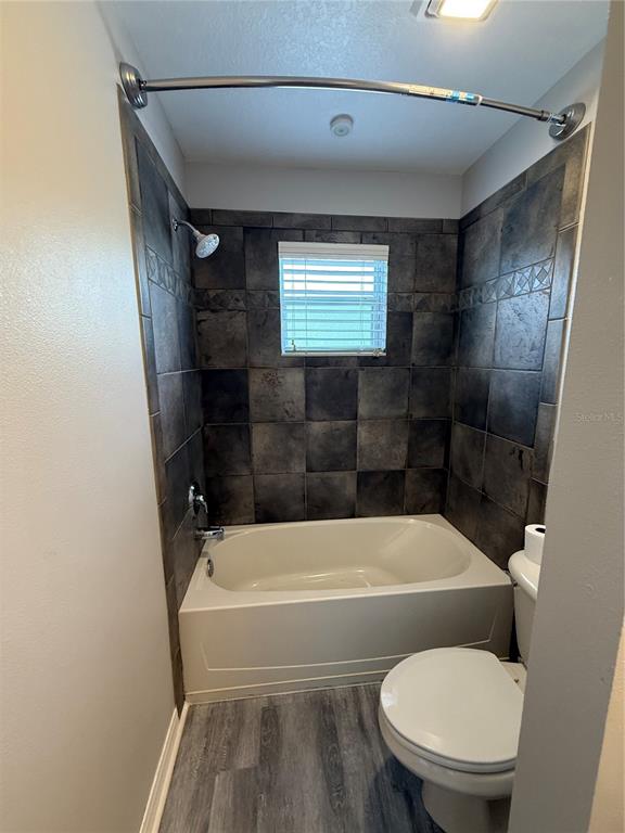20460 Needletree Drive Tampa, FL 33647 - Photo 19 of 28 a bathroom with a toilet and a shower