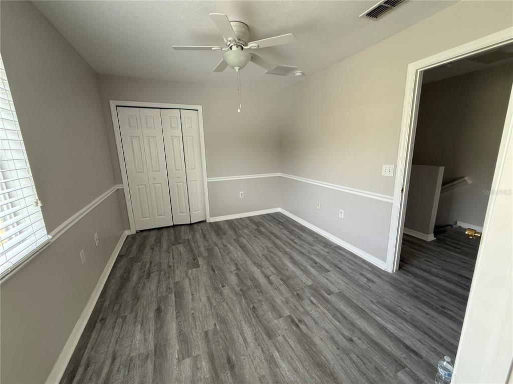 20460 Needletree Drive Tampa, FL 33647 - Photo 21 of 28 wooden floor in an empty room with a window