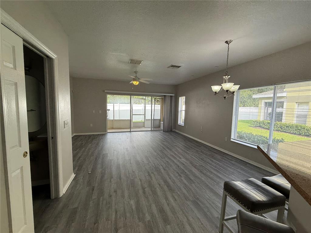 20460 Needletree Drive Tampa, FL 33647 - Photo 8 of 28 wooden floor in an empty room with a window