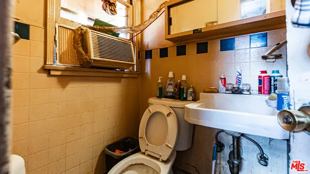 a bedroom with bed and a window