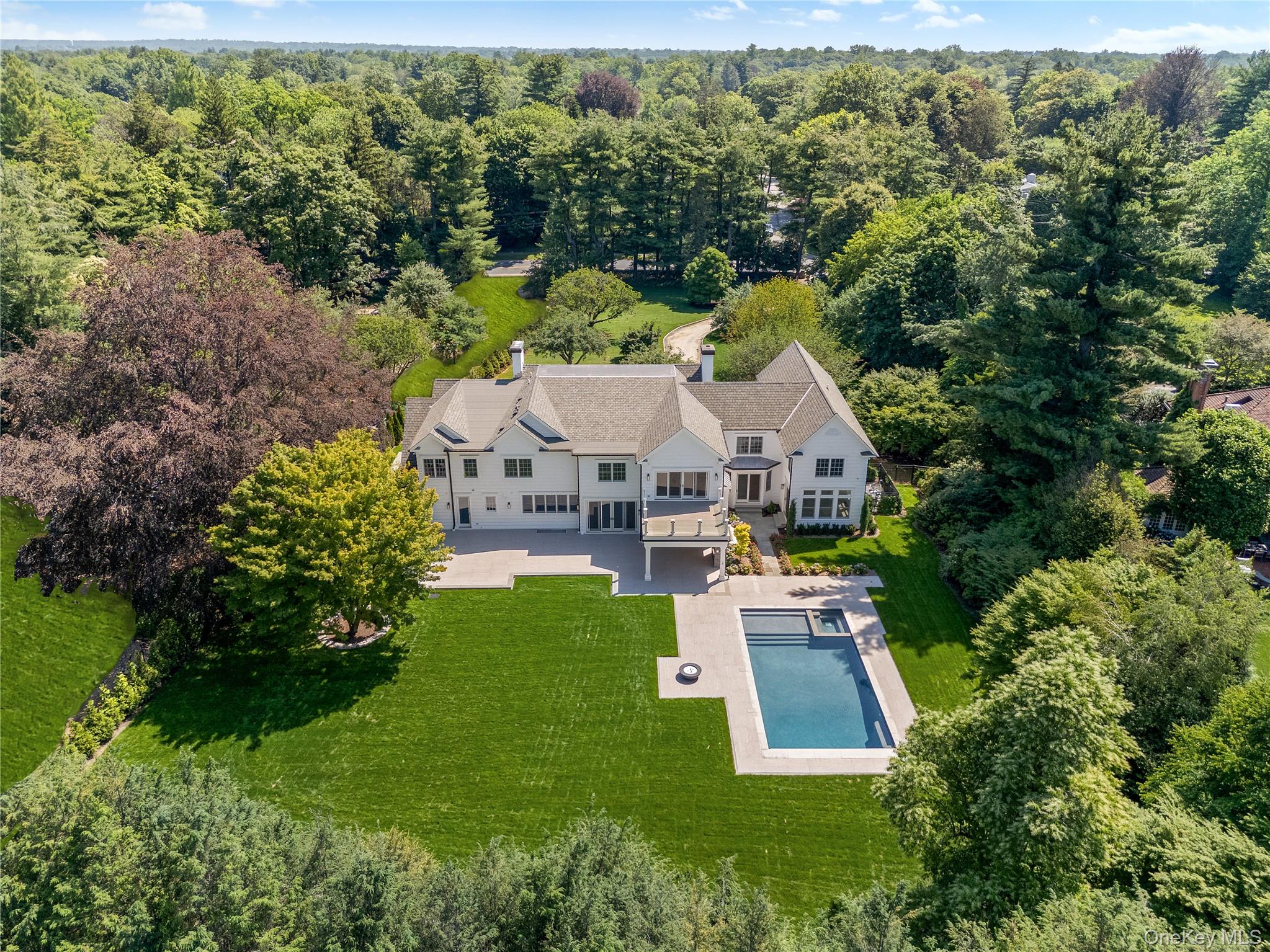 42 Mamaroneck Road Scarsdale, NY 10583 - Photo 3 of 47 A breathtaking aerial perspective showcases the expansive level property, spectacular outdoor living spaces, and resort-style backyard.