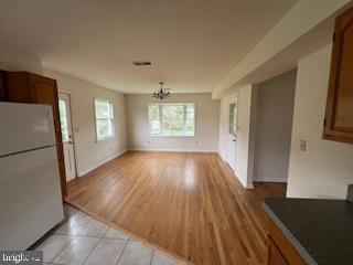 242 Marlborough Road Kennett Square, PA 19348 - Photo 5 of 9 a view of empty room with window and wooden floor