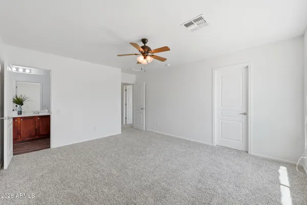a view of a terrace with furniture and a garden