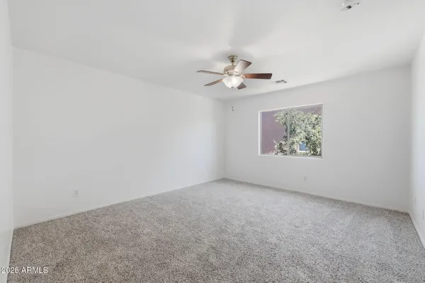 a view of a patio with table and chairs