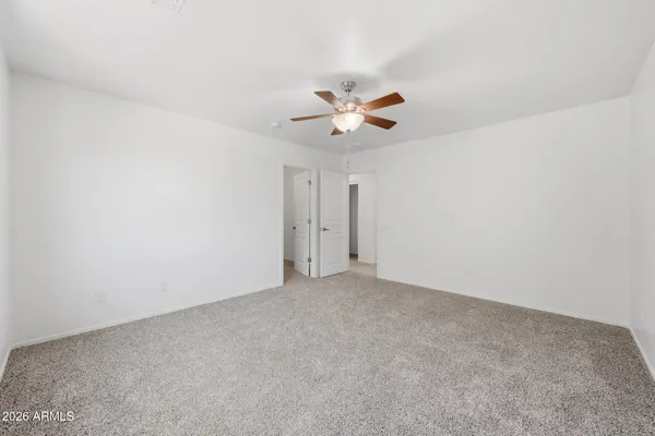 a view of a house with swimming pool and sitting area
