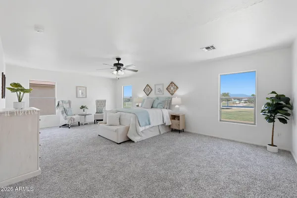 a living room with furniture and a lamp