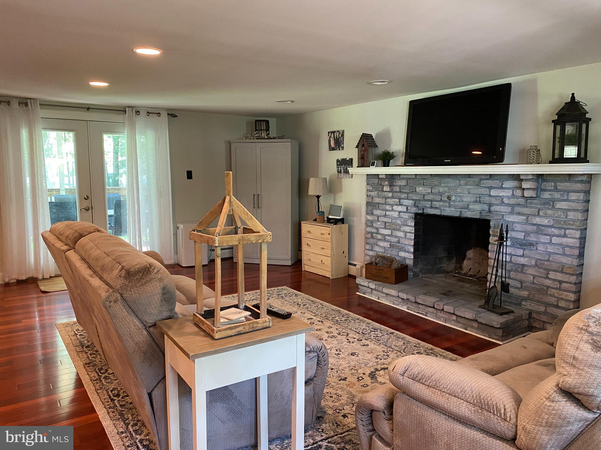 90 Grassy Lake Road Shamong, NJ 08088 - Photo 20 of 29 Downstairs family room with wood burning FP