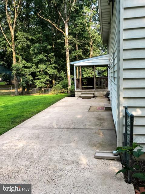 90 Grassy Lake Road Shamong, NJ 08088 - Photo 27 of 29 Screened porch with a concrete patio