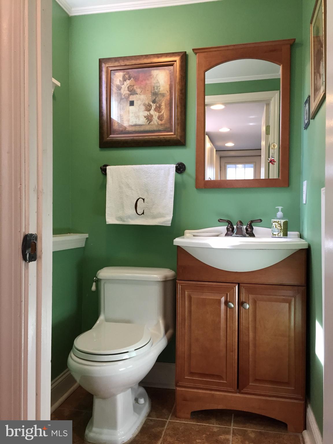 109 Valley Forge Terrace Wayne, PA 19087 - Photo 13 of 13 a bathroom with a toilet sink and mirror