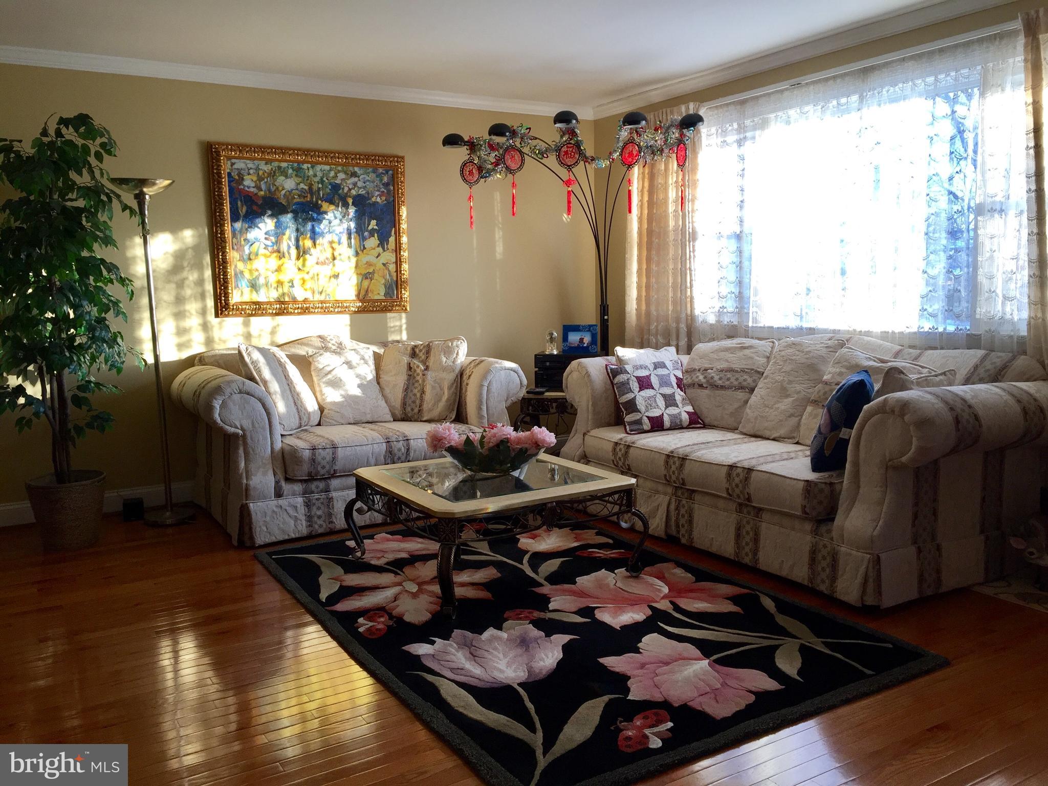 109 Valley Forge Terrace Wayne, PA 19087 - Photo 3 of 13 a living room with furniture and a large window