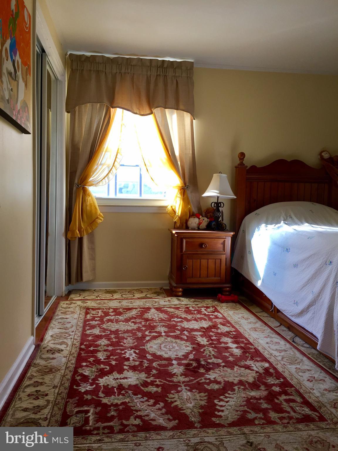 109 Valley Forge Terrace Wayne, PA 19087 - Photo 7 of 13 a bedroom with a bed and a window