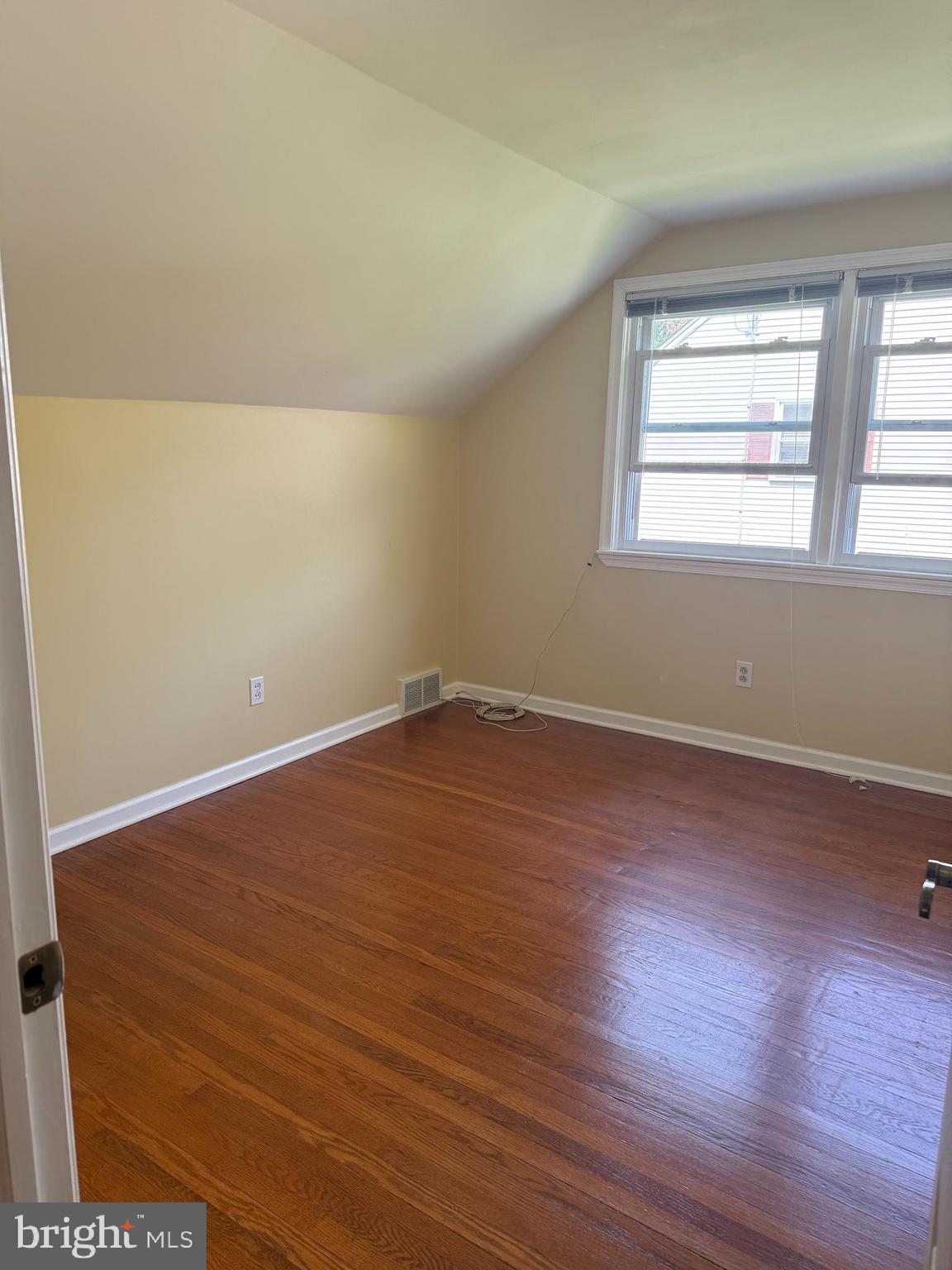 109 Valley Forge Terrace Wayne, PA 19087 - Photo 9 of 13 an empty room with wooden floor and windows