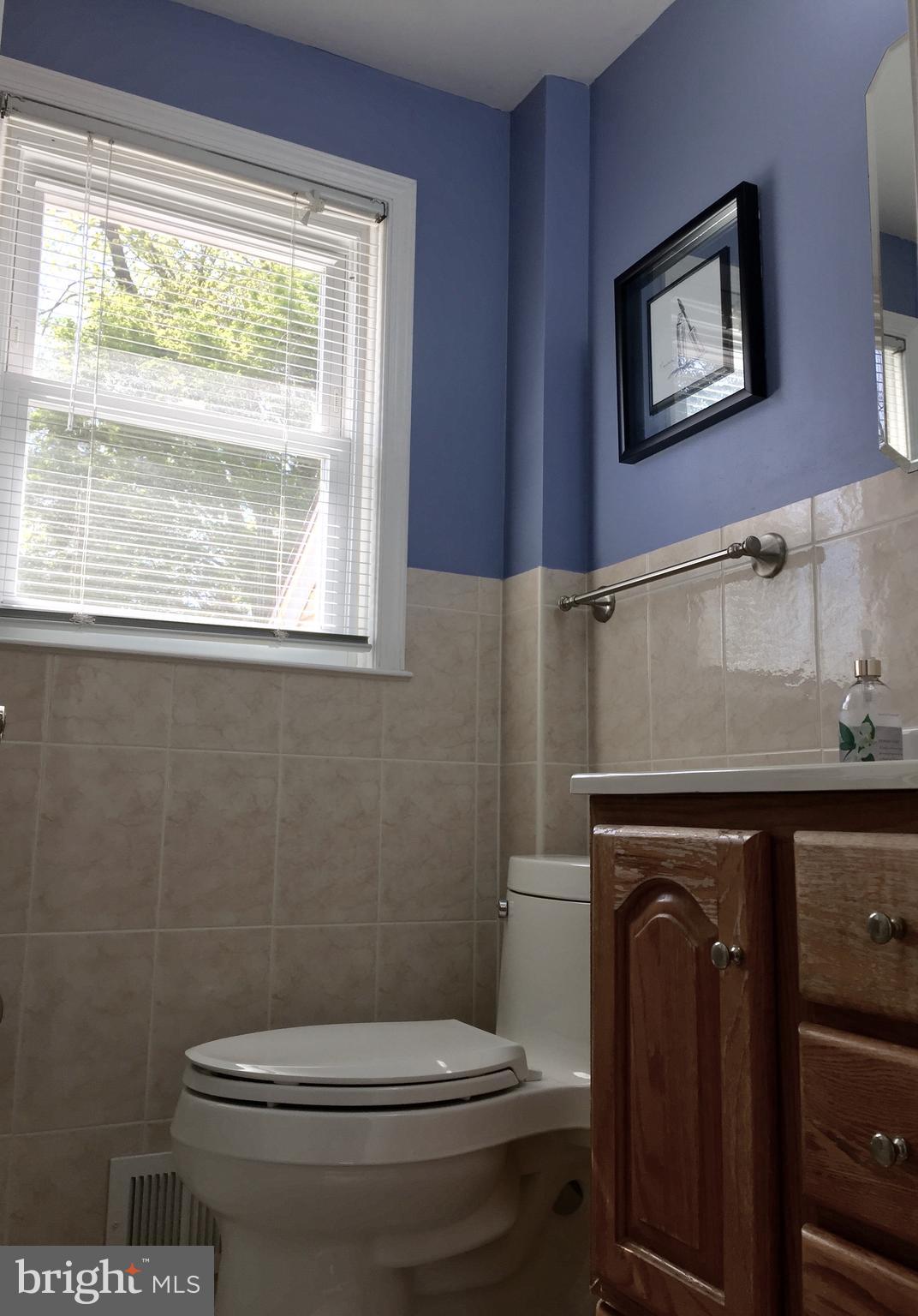 109 Valley Forge Terrace Wayne, PA 19087 - Photo 10 of 13 a bathroom with a toilet a sink and a window