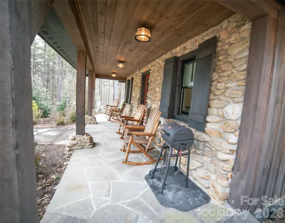 a building outdoor space with patio furniture and potted plants