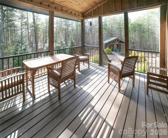 a view of a chairs and table in the balcony