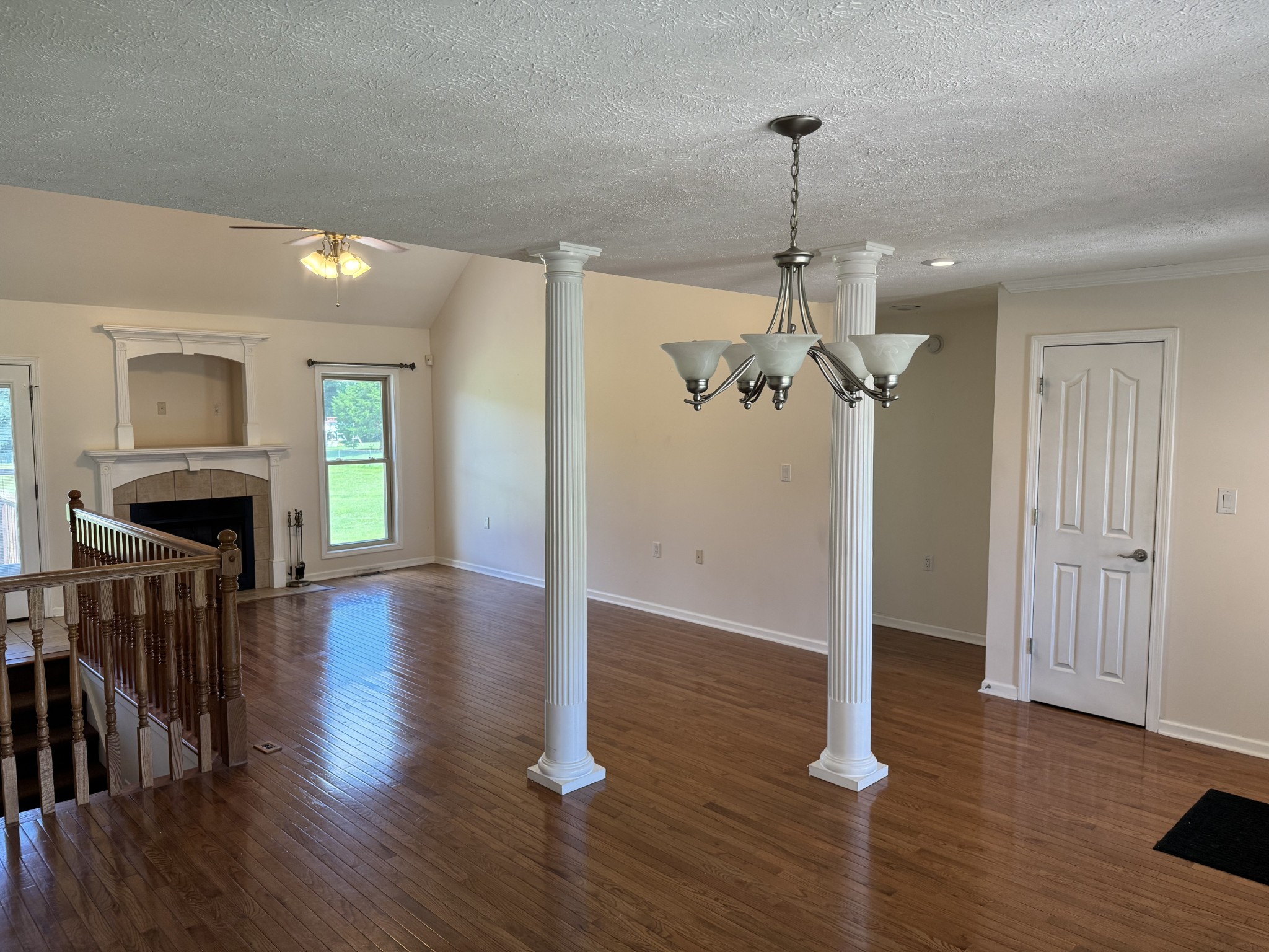 2105 Lock B Road North Clarksville, TN 37043 - Photo 14 of 30 a view of a livingroom with wooden floor and a ceiling fan