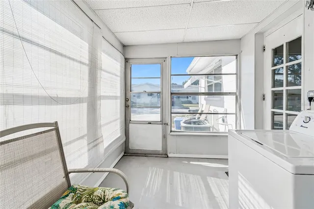 a kitchen with a sink and large window