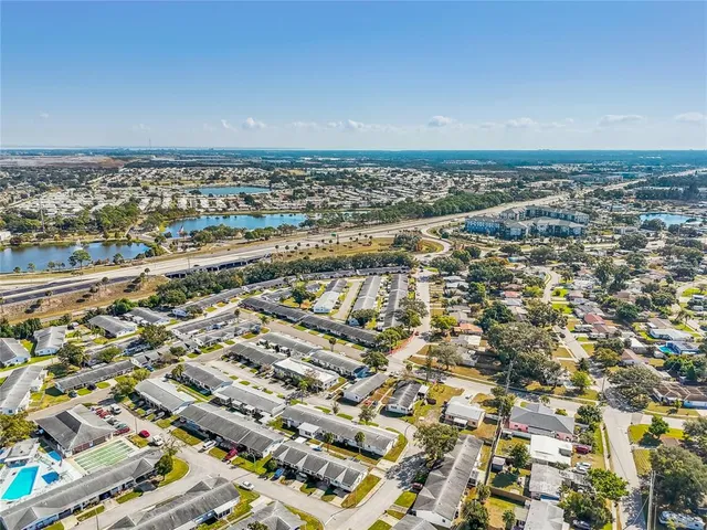 an aerial view of residential building and car parked
