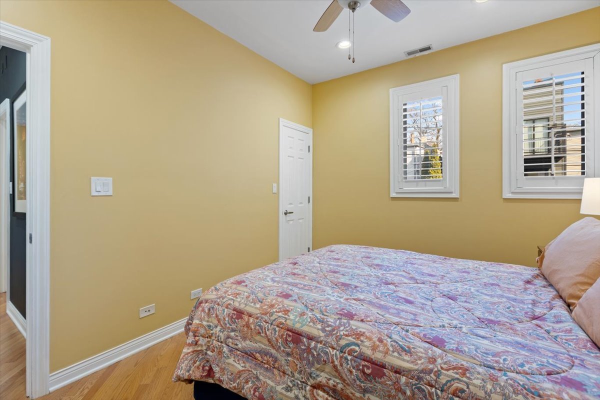 1249 North Wolcott Avenue, Unit 2 Chicago, IL 60622 - Photo 20 of 26 a bedroom with a bed and a window