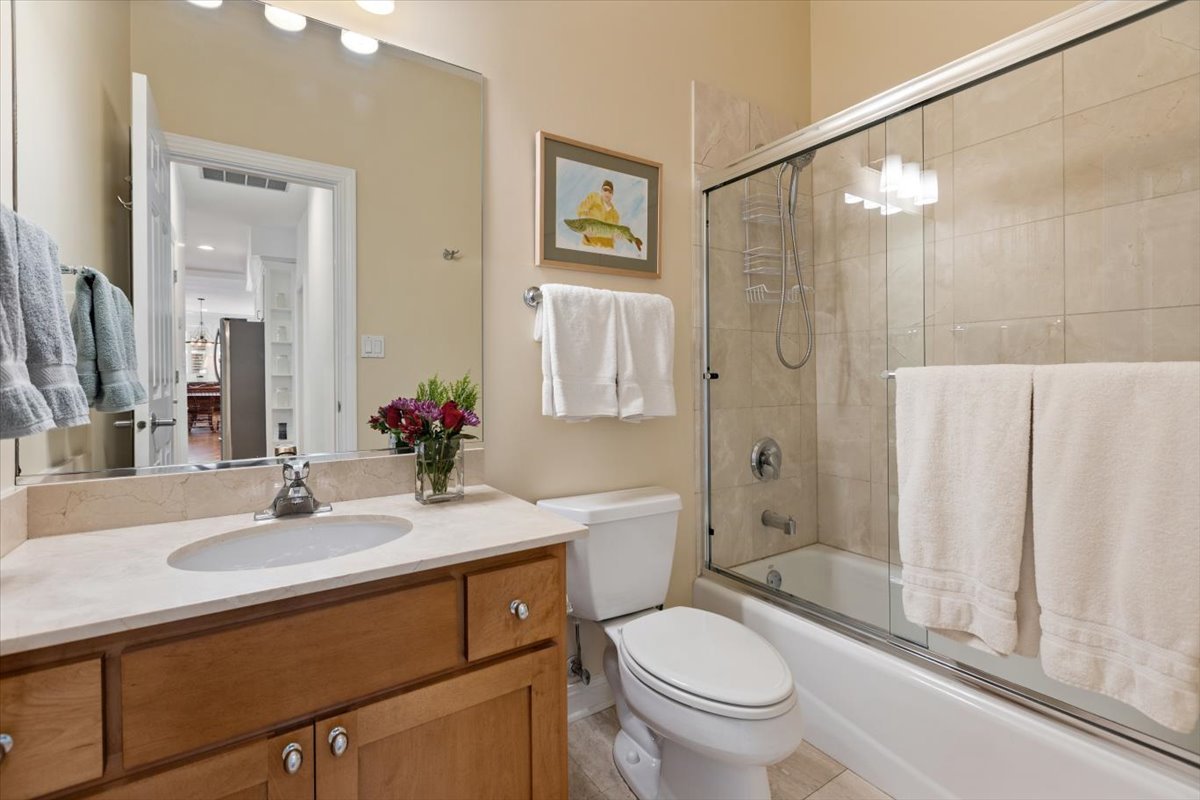 1249 North Wolcott Avenue, Unit 2 Chicago, IL 60622 - Photo 21 of 26 a bathroom with a sink toilet and shower