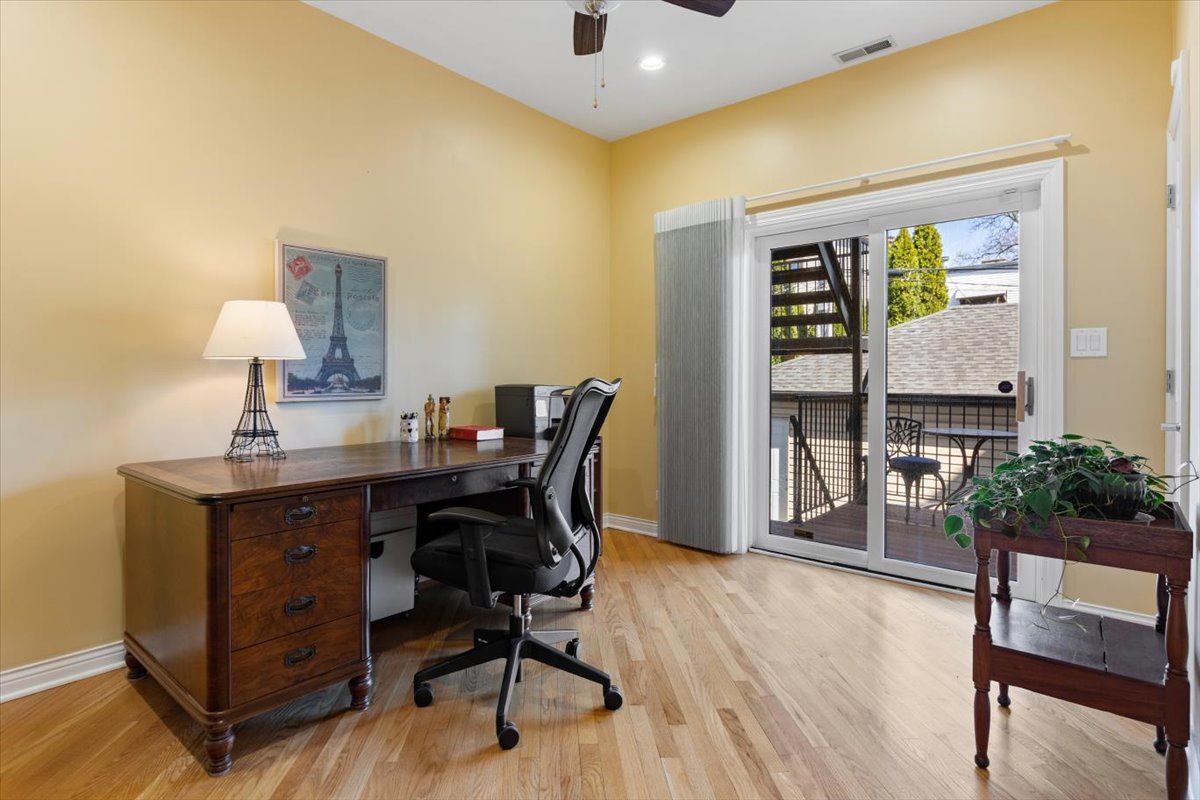 1249 North Wolcott Avenue, Unit 2 Chicago, IL 60622 - Photo 22 of 26 a view of a workspace with furniture and a window