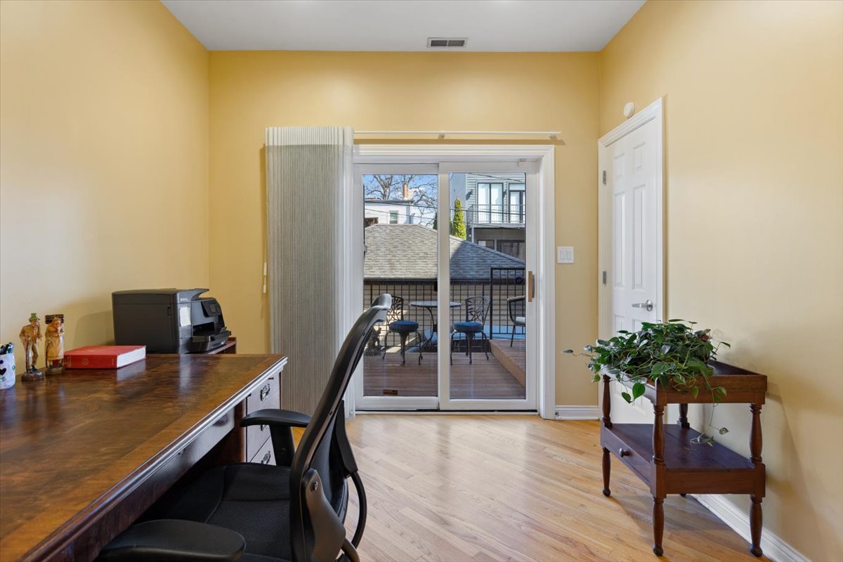 1249 North Wolcott Avenue, Unit 2 Chicago, IL 60622 - Photo 23 of 26 a workspace with furniture and wooden floor