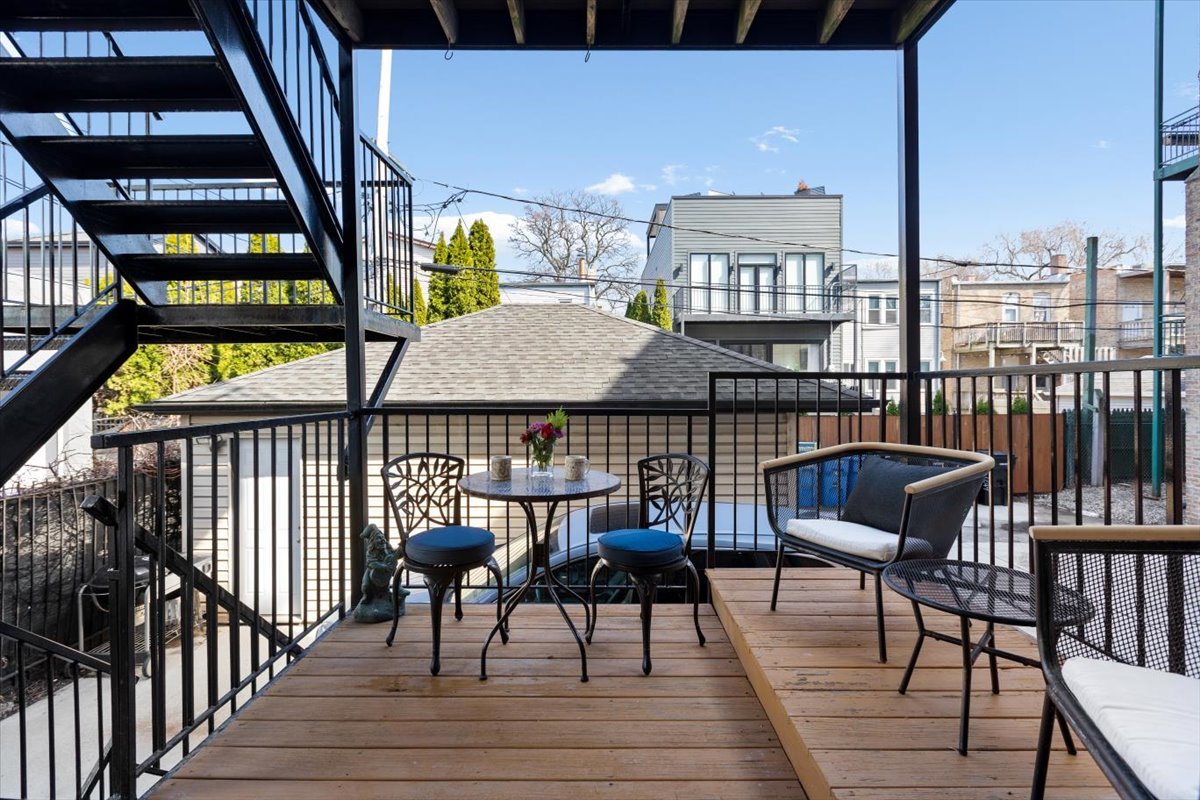 1249 North Wolcott Avenue, Unit 2 Chicago, IL 60622 - Photo 24 of 26 a view of a balcony with chairs