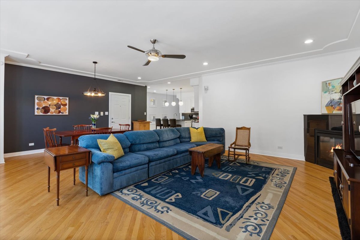 1249 North Wolcott Avenue, Unit 2 Chicago, IL 60622 - Photo 6 of 26 a living room with furniture a rug and a flat screen tv