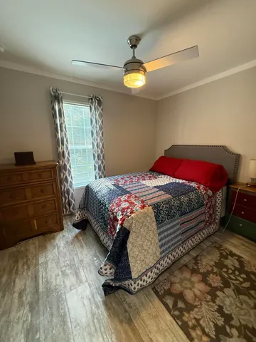 a bedroom with a bed and a dresser