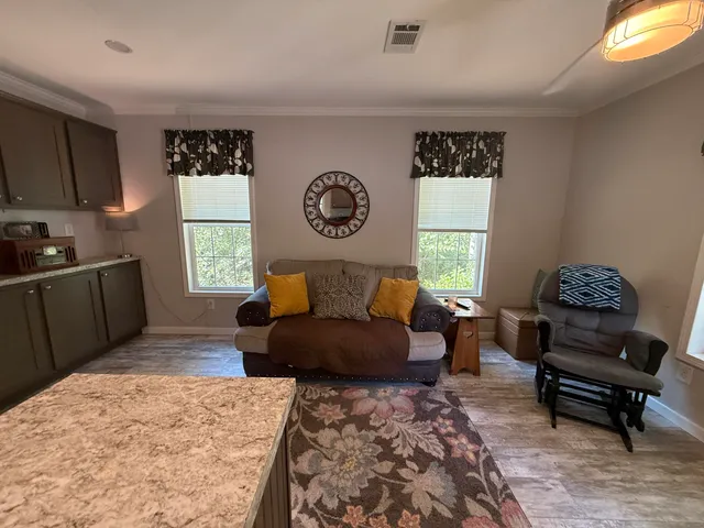 a bedroom with furniture and a window