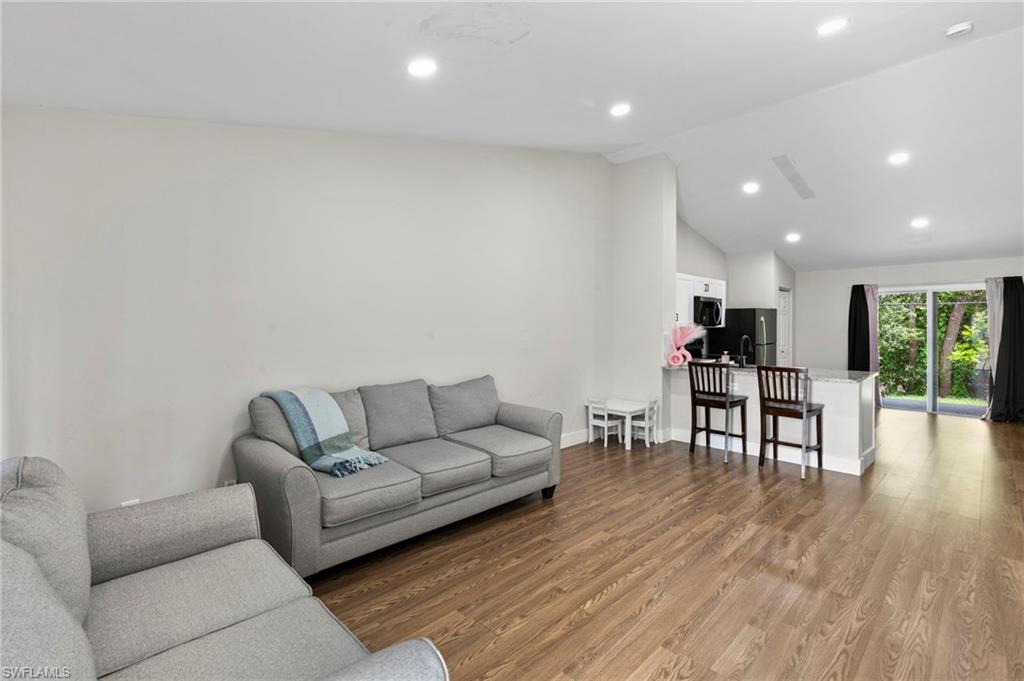 8264-8268 Matanzas Road Fort Myers, FL 33967 - Photo 15 of 33 a living room with furniture and wooden floor