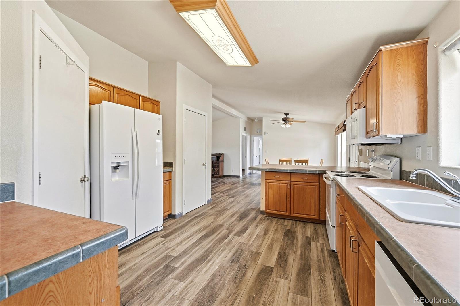 20300 Old Ranch Loop Nathrop, CO 81236 - Photo 8 of 35 a kitchen with a sink a counter top space stainless steel appliances a window and a counter space