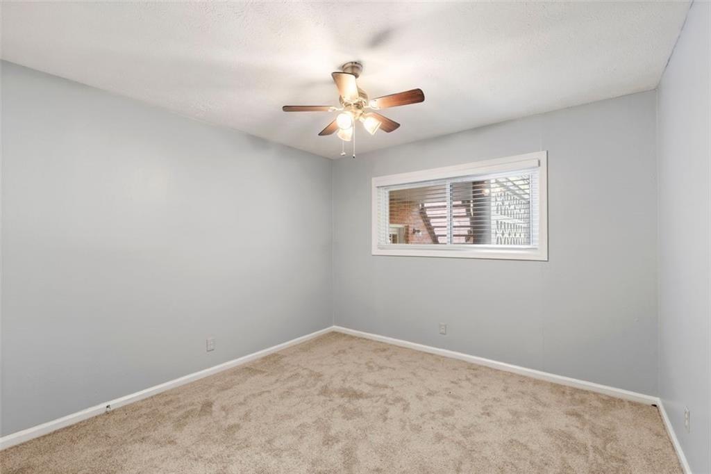 1822 North Rock Springs Road Northeast, Unit 7 Atlanta, GA 30324 - Photo 16 of 21 a view of an empty room with a window