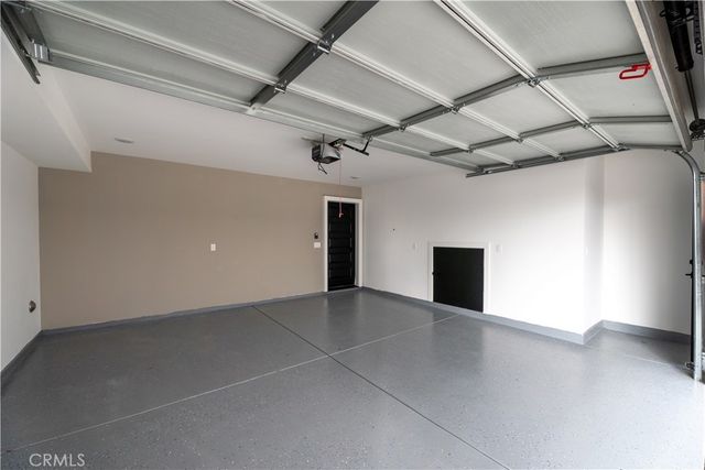 a kitchen with kitchen island granite countertop a sink a stove and cabinets