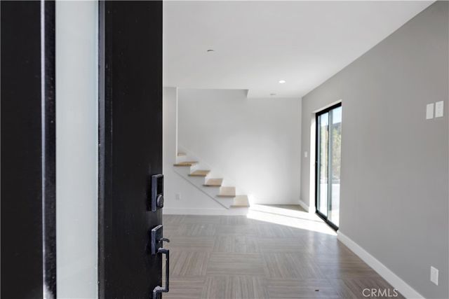 a large kitchen with stainless steel appliances granite countertop a stove and a sink