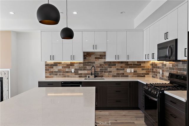 a hallway with windows and white walls