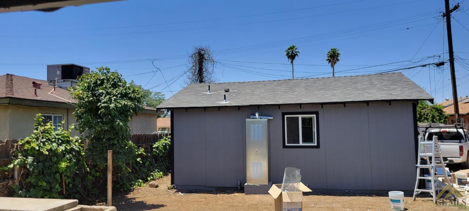 Undisclosed Address Bakersfield, CA 93308 - Photo 11 of 15 a front view of a house with a yard