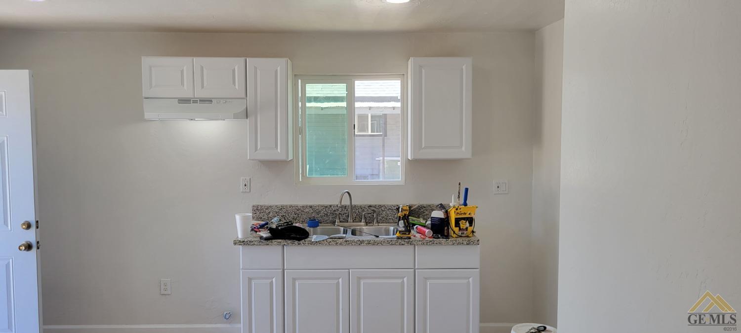 Undisclosed Address Bakersfield, CA 93308 - Photo 12 of 15 a kitchen with stainless steel appliances granite countertop a sink and cabinets