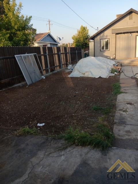 Undisclosed Address Bakersfield, CA 93308 - Photo 15 of 15 a view of a house with a yard