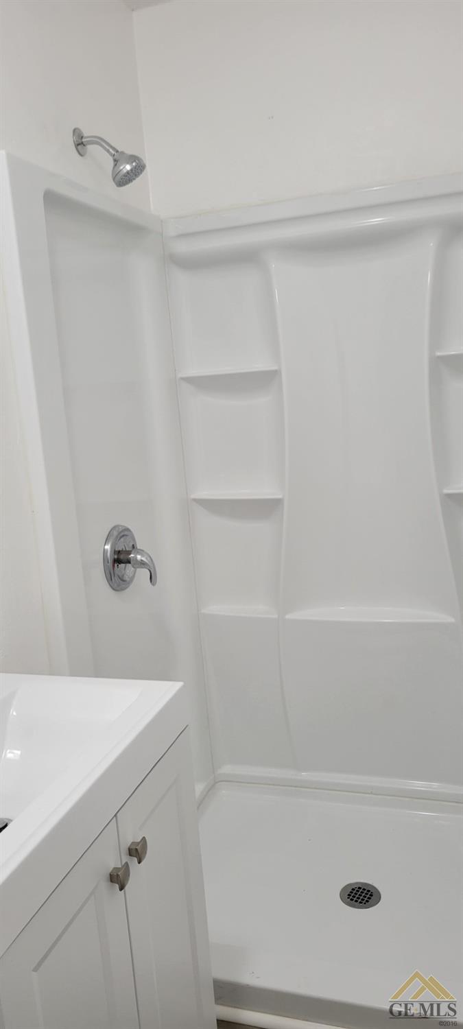 Undisclosed Address Bakersfield, CA 93308 - Photo 7 of 15 a bathroom with a bathtub