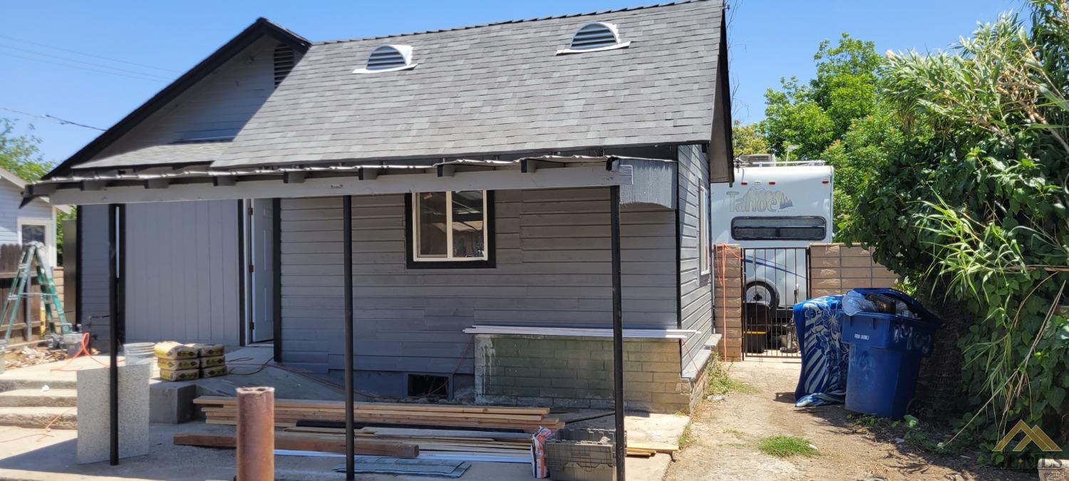 Undisclosed Address Bakersfield, CA 93308 - Photo 9 of 15 a front view of a house with garden
