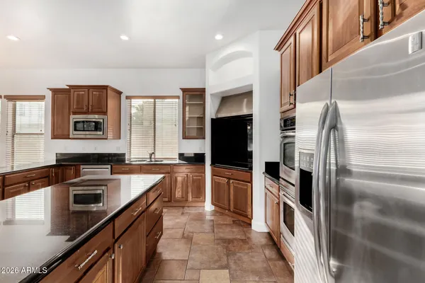 a kitchen that has a sink and a stove in it
