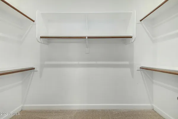 an empty room with a empty space and a ceiling fan
