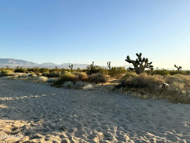 a view of a town with mountains in the background